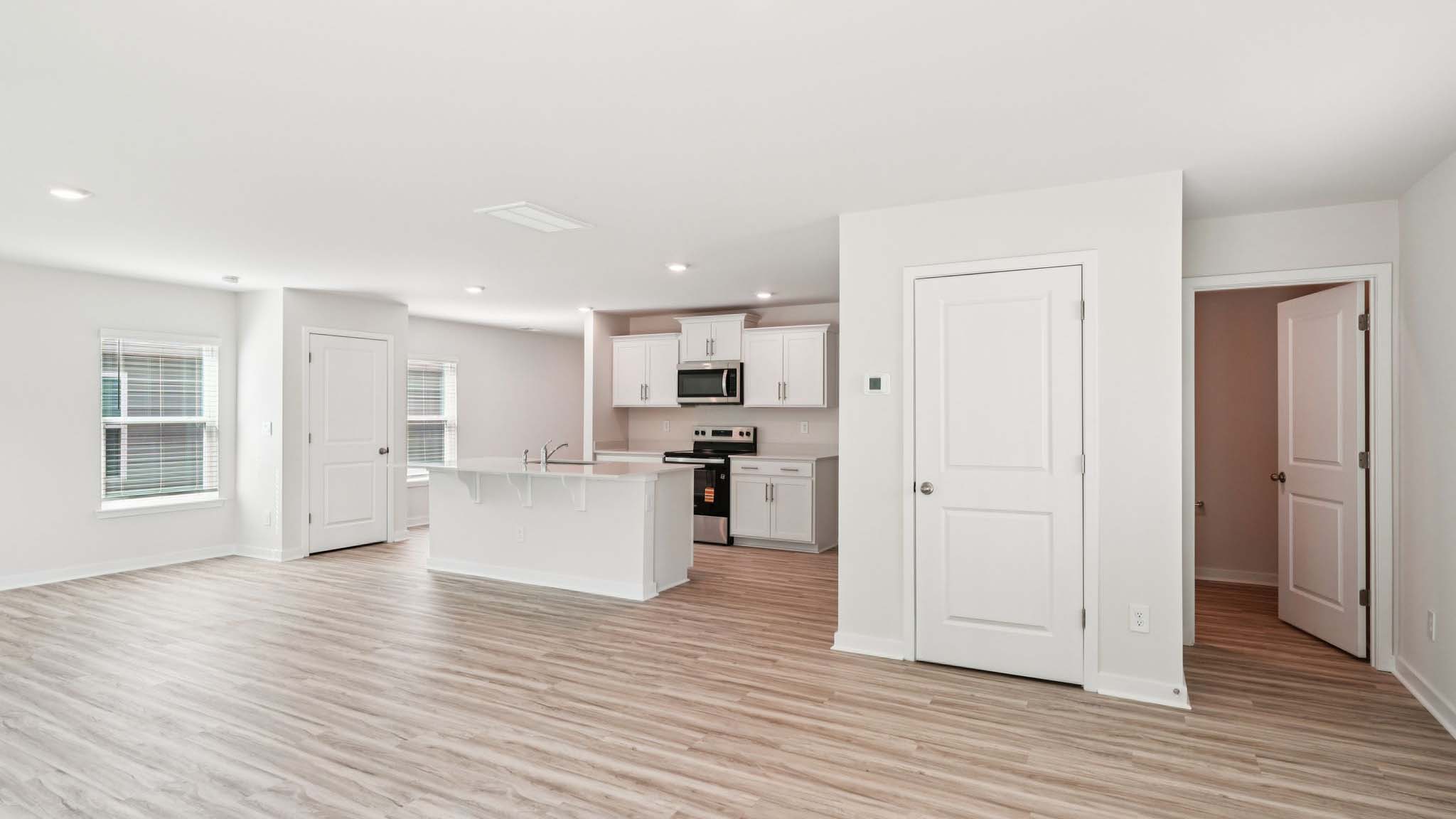 Open living area with view of kitchen