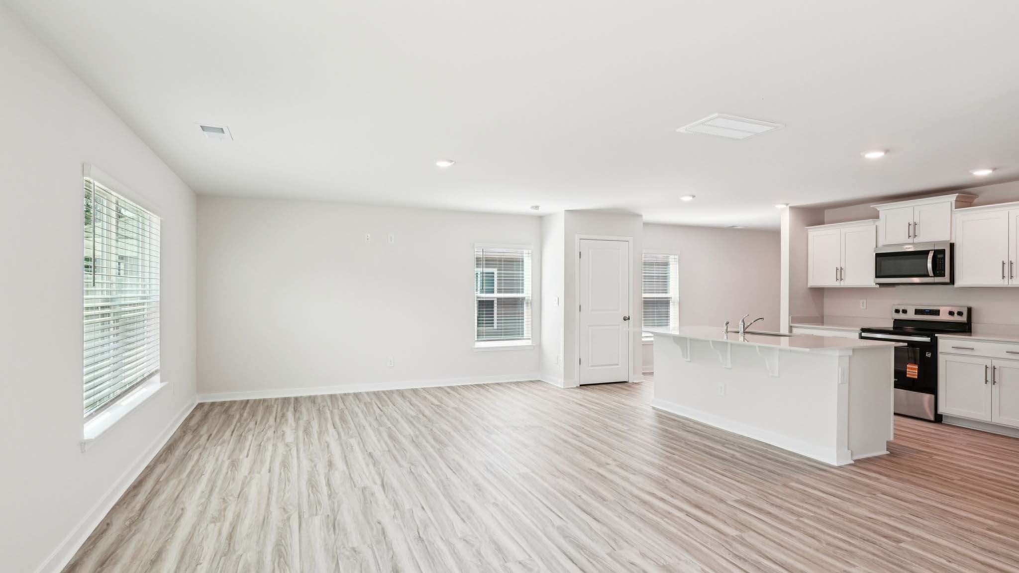 Open living area with view of kitchen