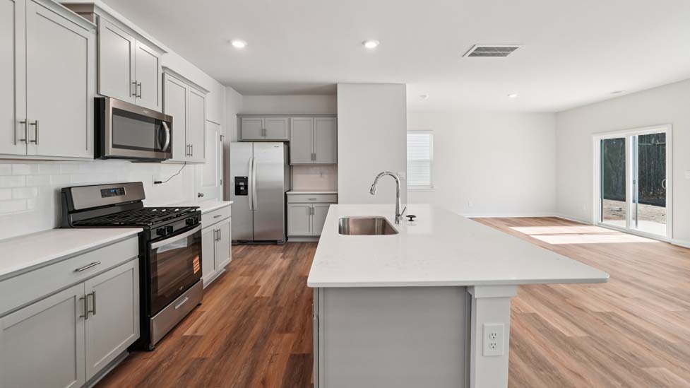 Kitchen with island and stainless steel appliances