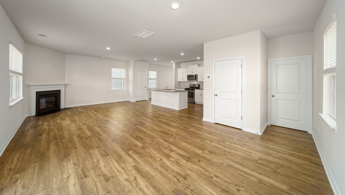 Spacious family room with windows and fireplace