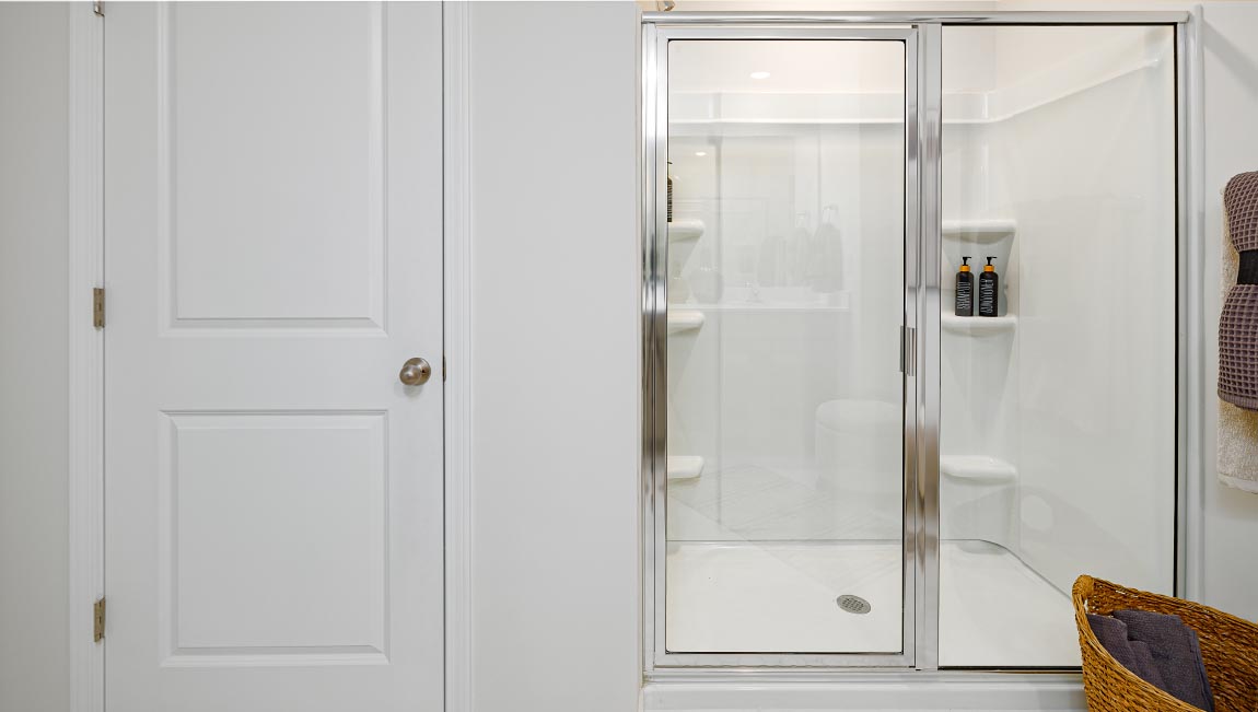 Primary bathroom with standing glass door shower. New Home in Asheville, North Carolina
