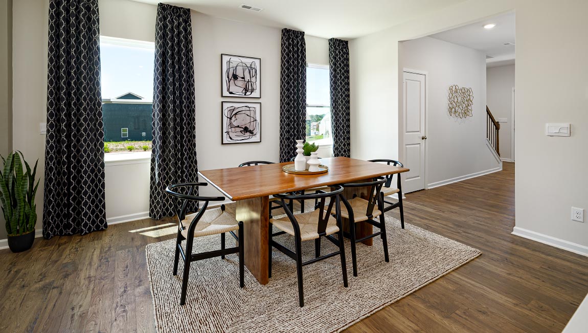 Dining area beside kitchen with two large windows. New Home in Asheville, North Carolina