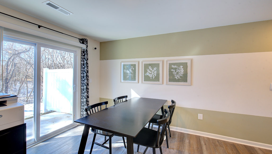 Breakfast area beside kitchen and sliding glass back door. New Homes in Asheville, North Carolina
