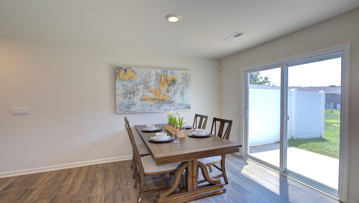 Breakfast area beside kitchen and sliding glass back door. New Homes in Asheville, North Carolina