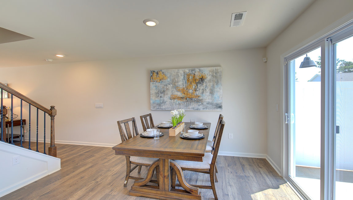 Breakfast area beside kitchen and sliding glass back door. New Homes in Asheville, North Carolina