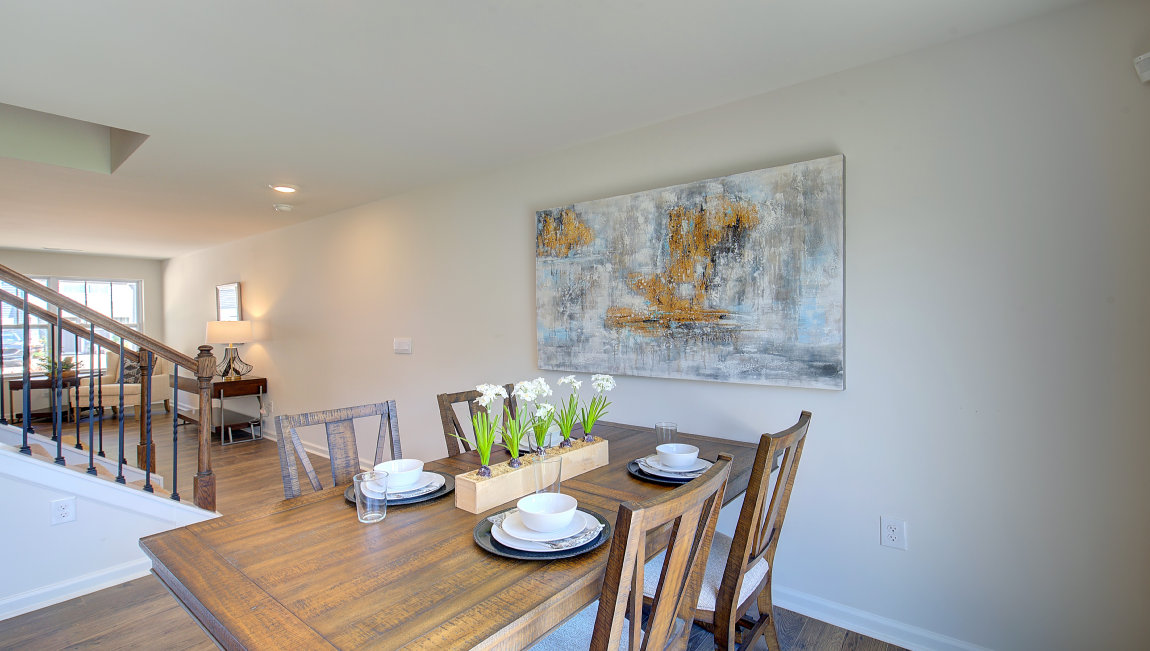 Breakfast area beside kitchen and sliding glass back door. New Homes in Asheville, North Carolina