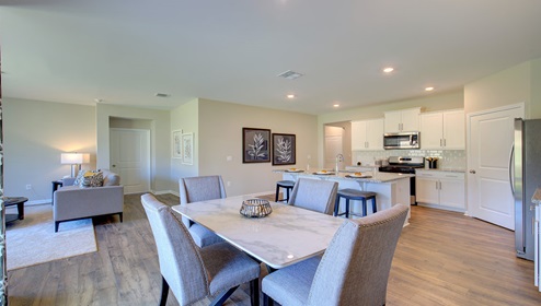 Breakfast area beside kitchen and sliding glass back door