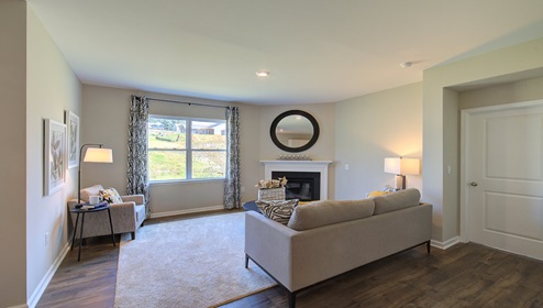 Living room with fireplace and large window