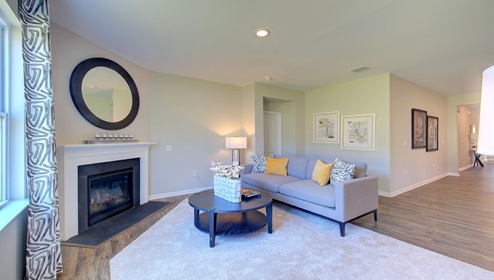 Living room with fireplace and large window