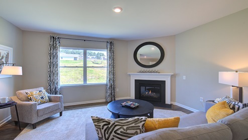 Living room with fireplace and large window