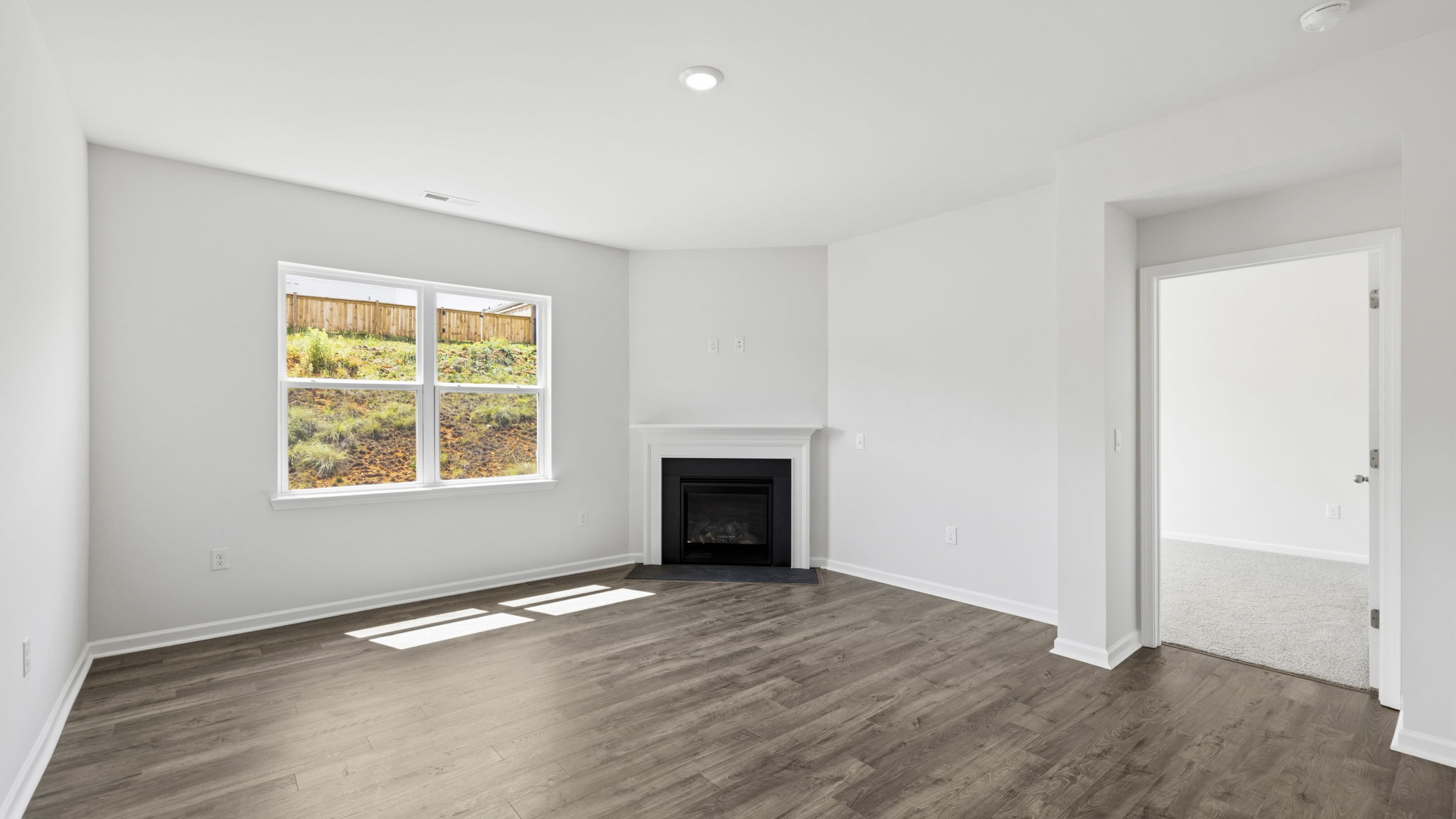 Open concept living area with gas fireplace