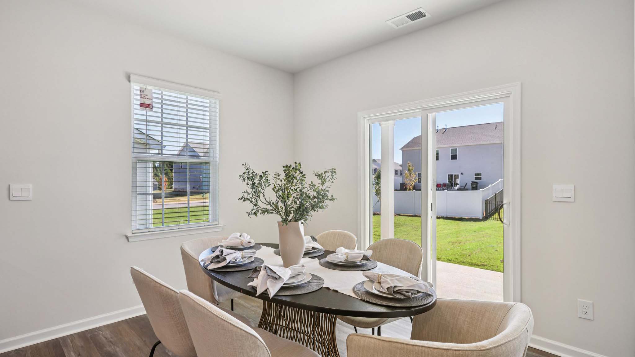Open concept dining area with glass sliding doors