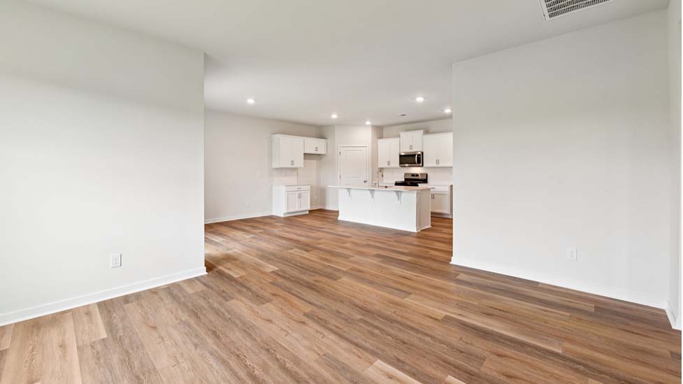 Open kitchen with stainless steel appliances and island
