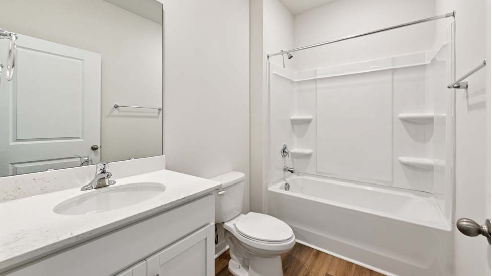 Bathroom with single vanity and bathtub