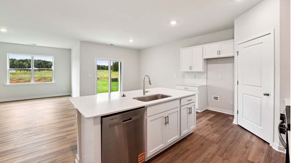 Open kitchen with stainless steel appliances and island