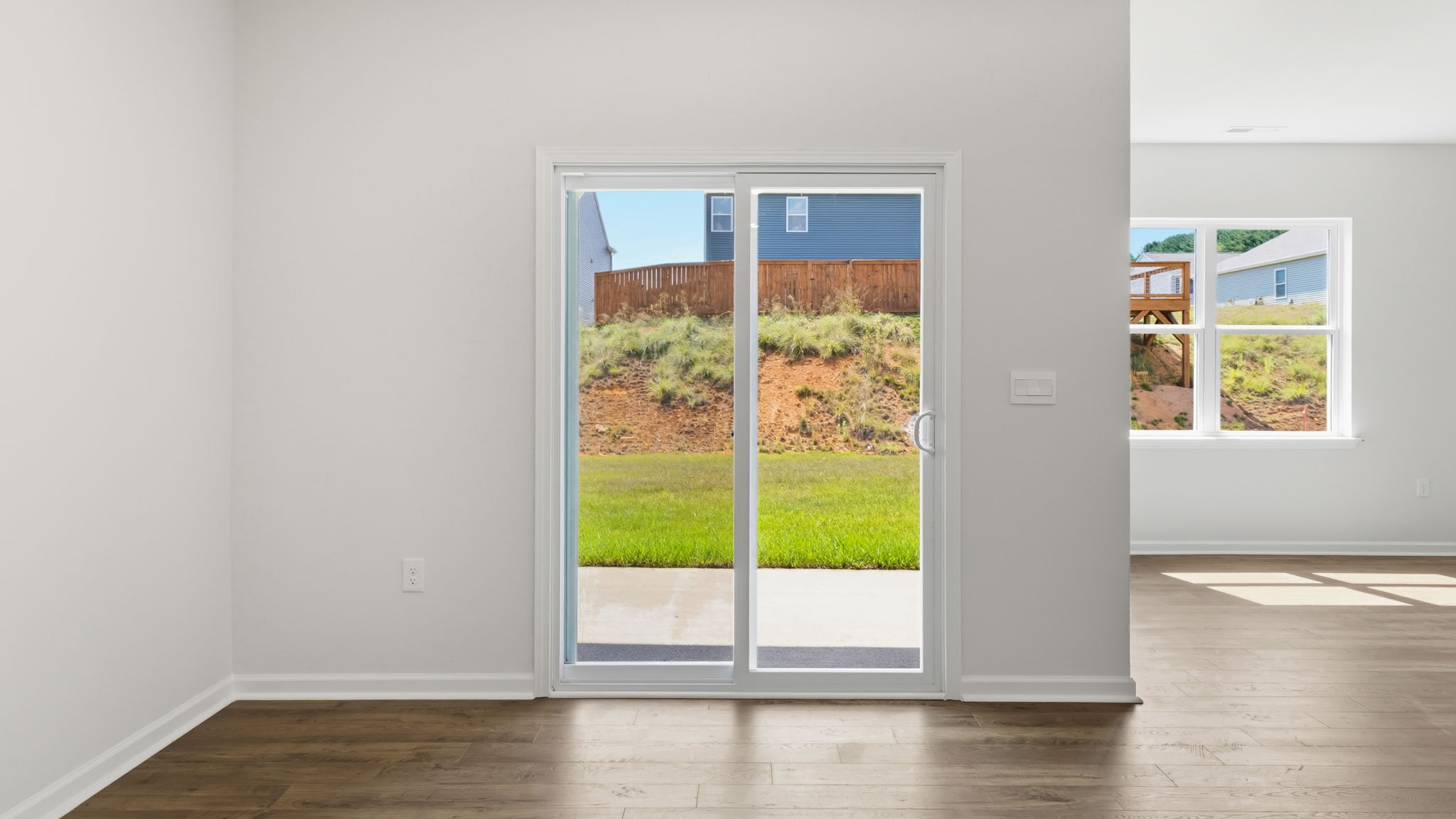 Open dining and living area with sliding glass door and gas fireplace