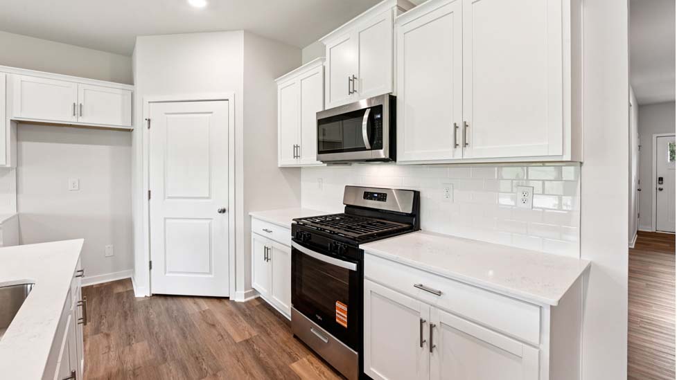 Open kitchen with stainless steel appliances and island