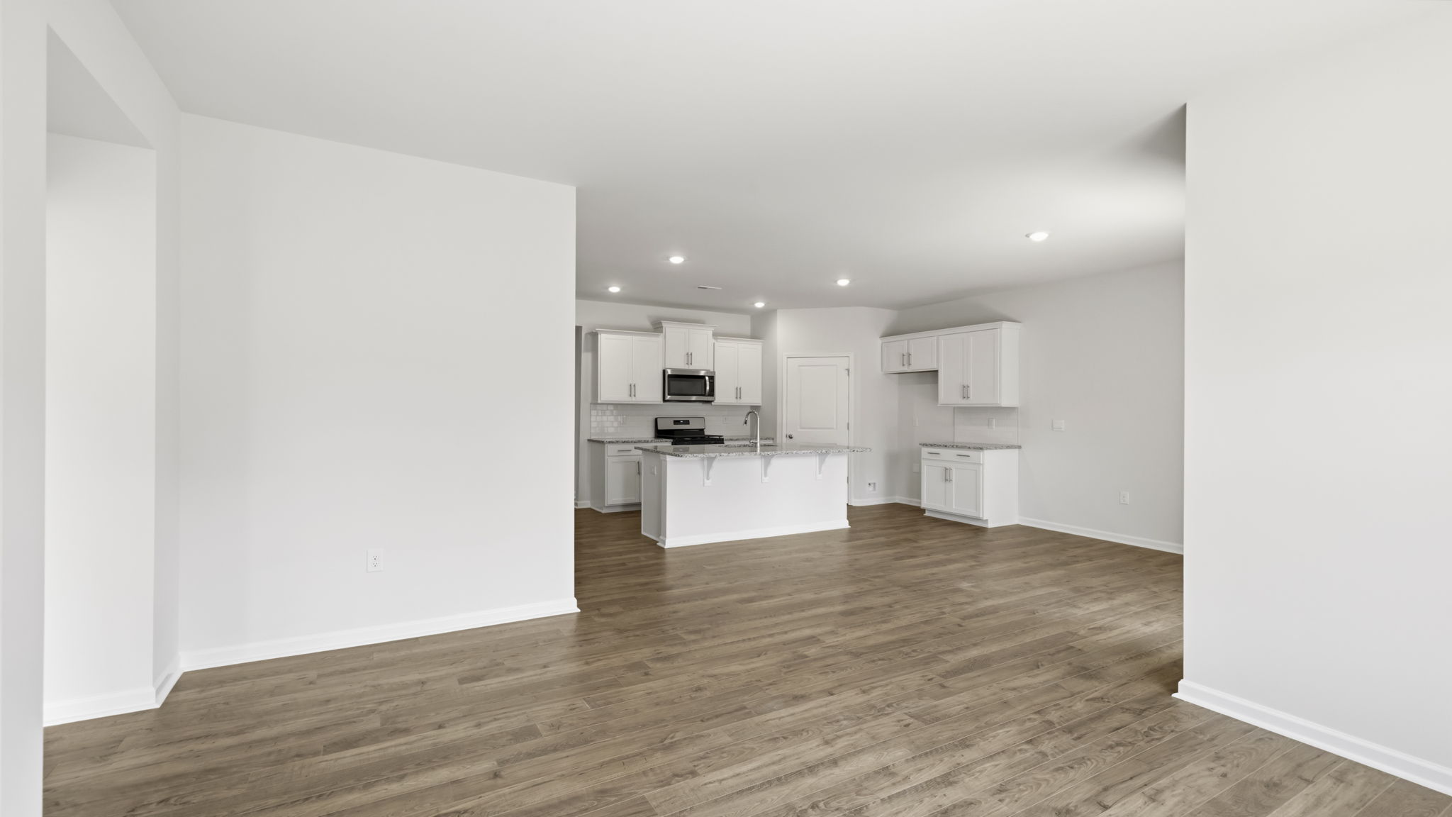Open living area with view of kitchen and island