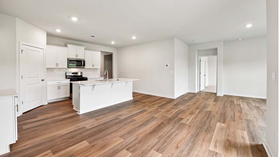 Open kitchen with stainless steel appliances and island