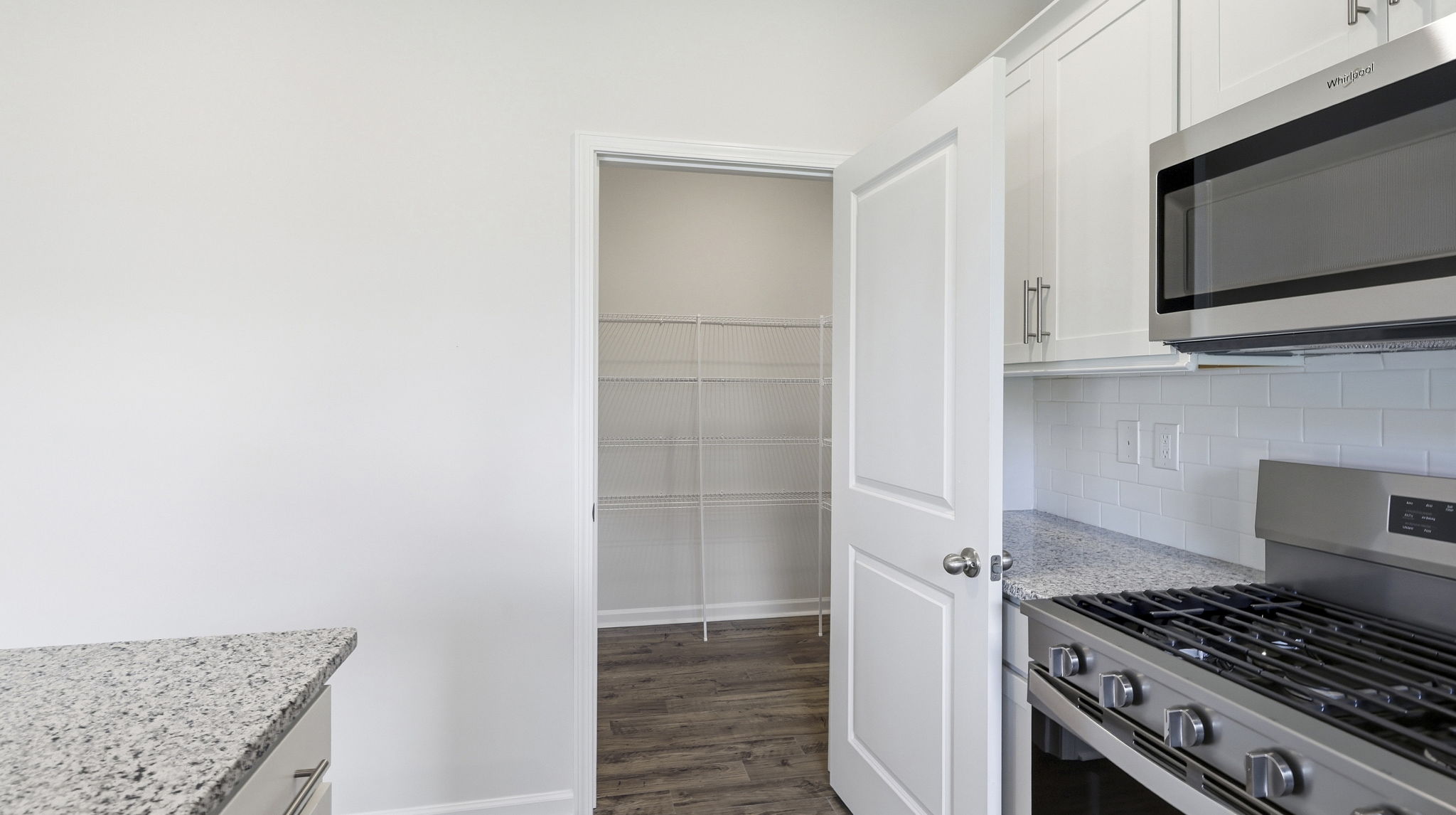 Open concept kitchen with large island and stainless steel appliances