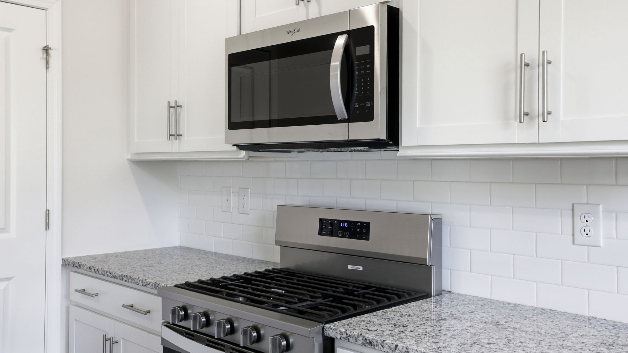 Open concept kitchen with large island and stainless steel appliances