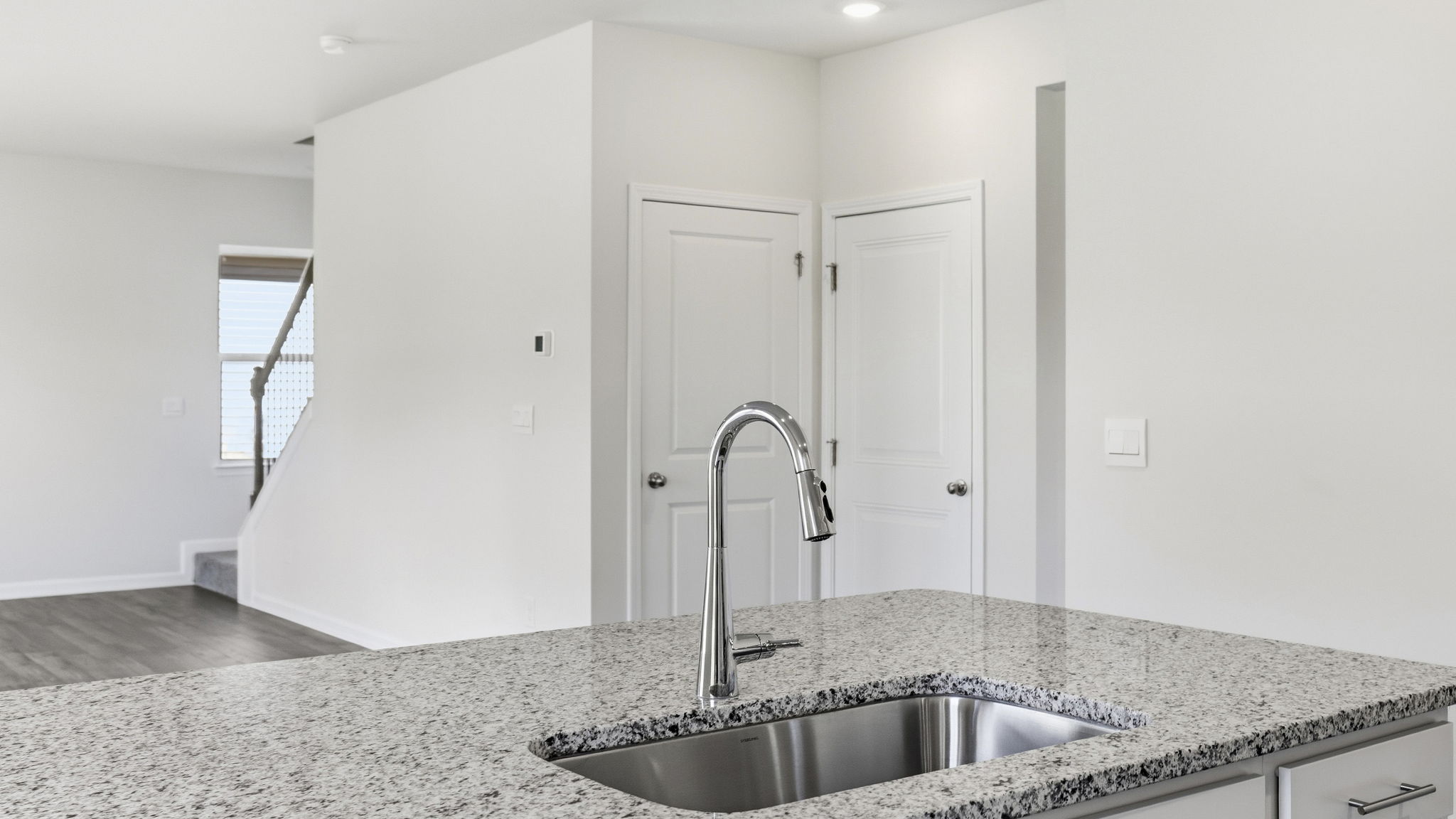 Open concept kitchen with large island and stainless steel appliances