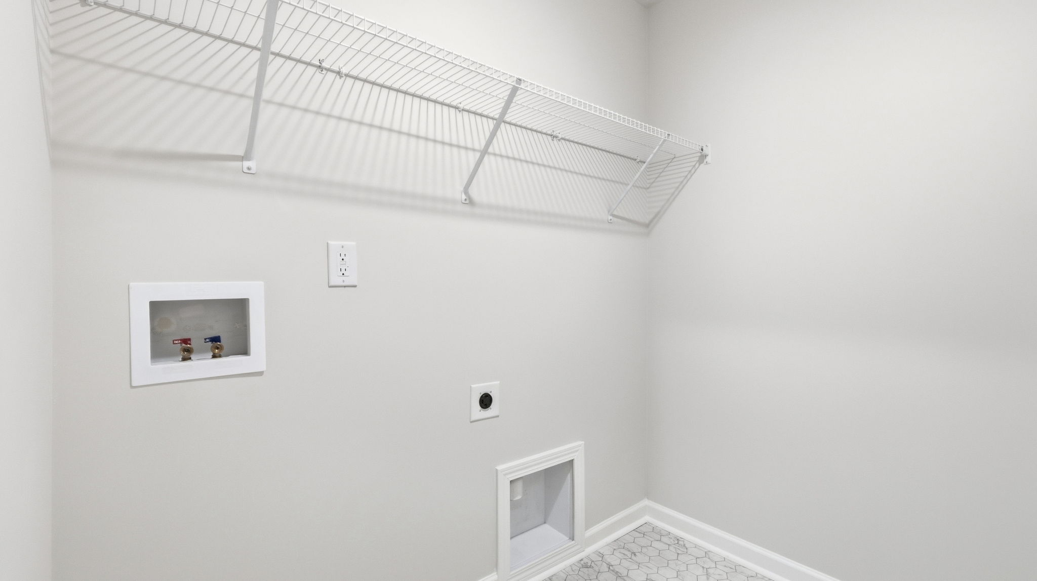 Laundry room with shelving