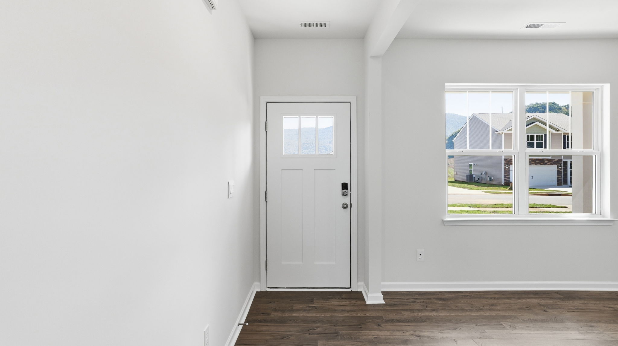 Welcoming foyer area with large windows