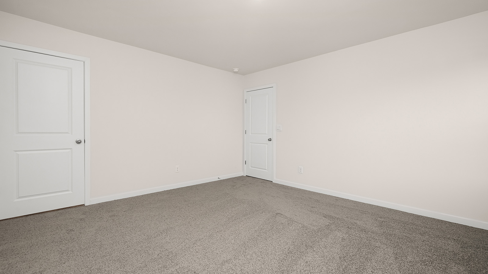 Carpeted bedroom with window