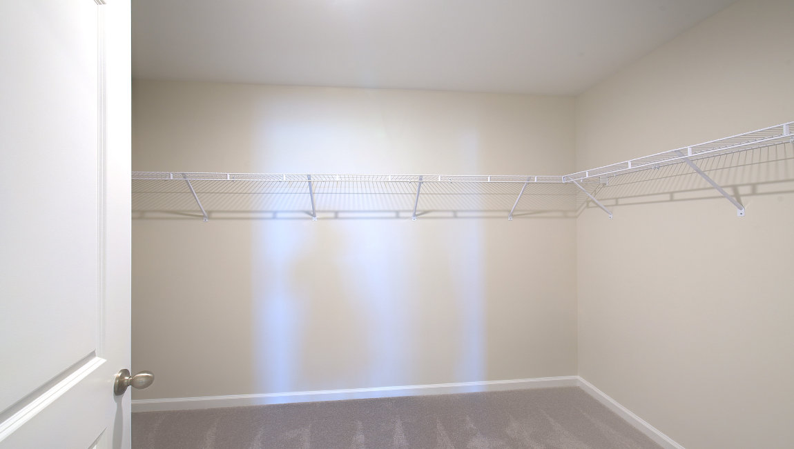 Primary bathroom with dual vanity and walk in shower