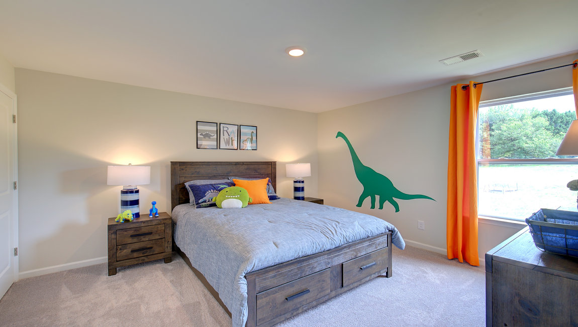Carpeted bedroom with large windows