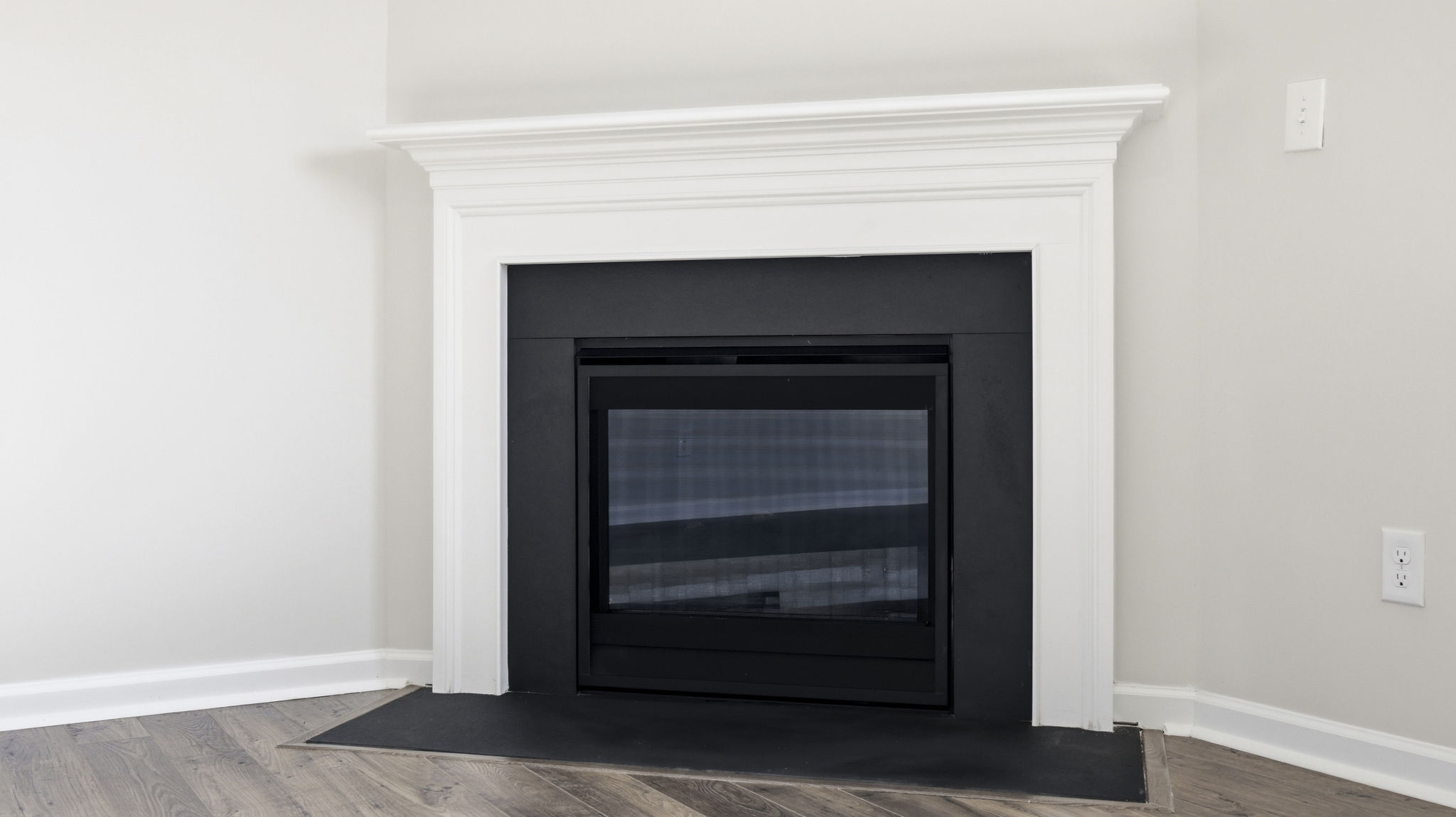 Open living area with large windows and gas fireplace
