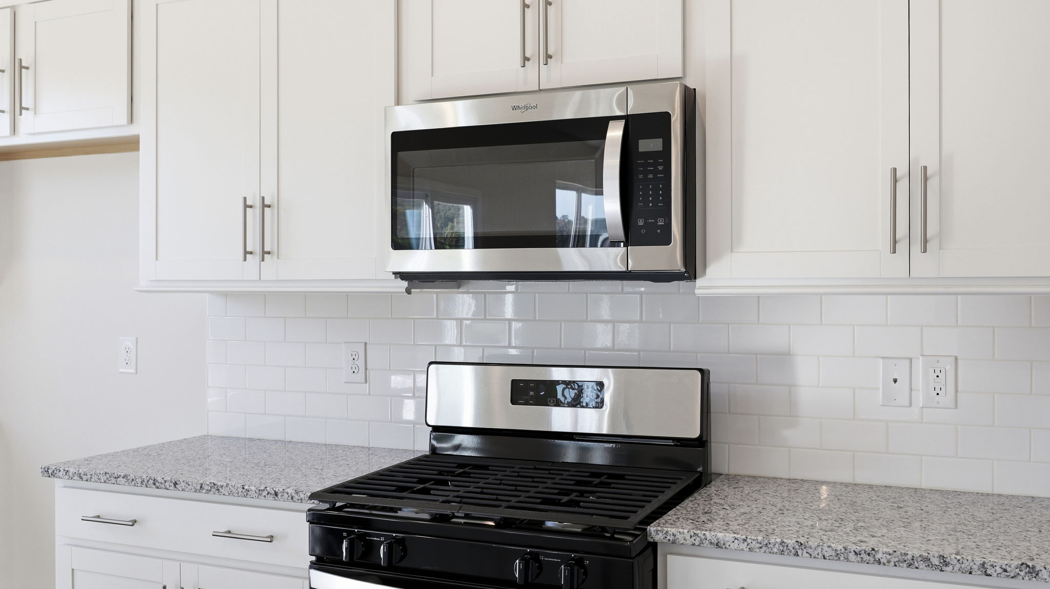 Open concept kitchen with large island and stainless steel appliances