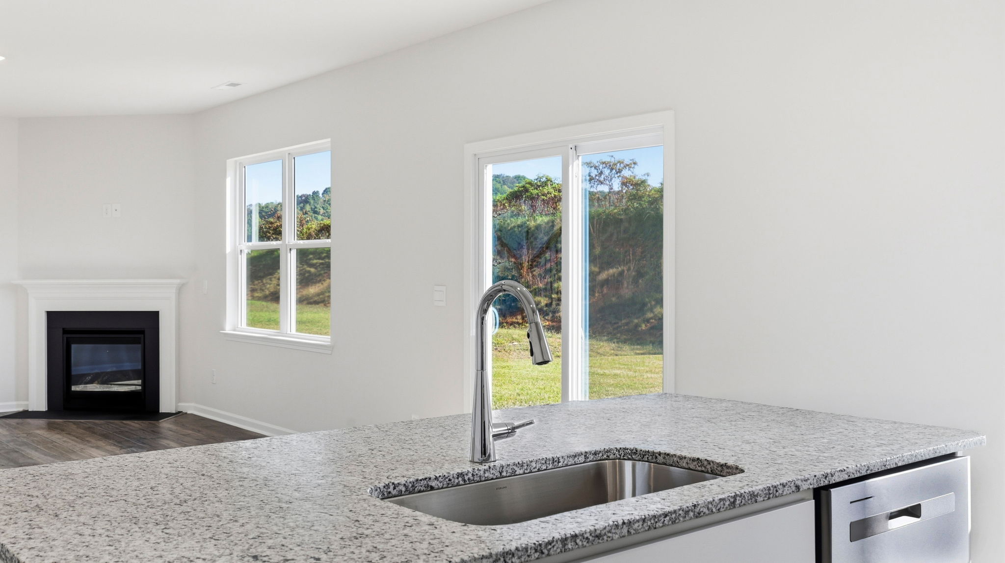 Open concept kitchen with large island and stainless steel appliances
