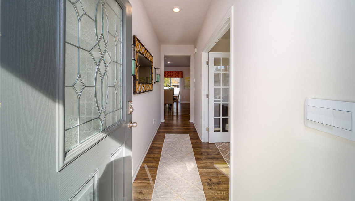 welcoming foyer with wood floors