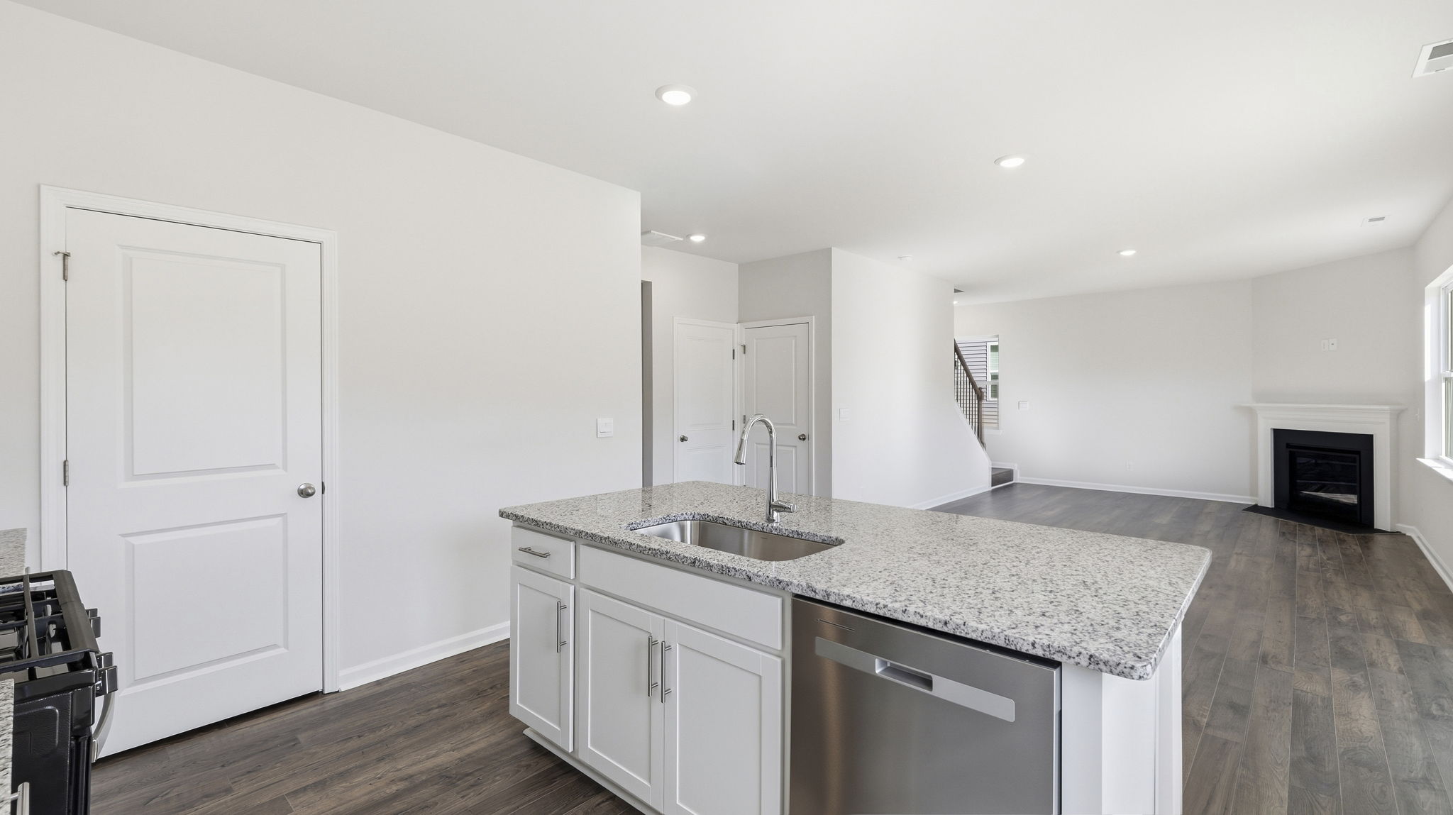 Open concept kitchen with large island and stainless steel appliances