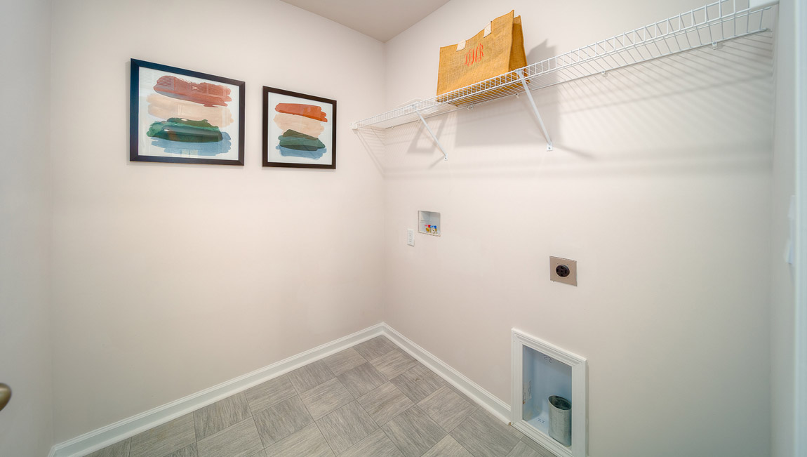 Laundry room with shelving