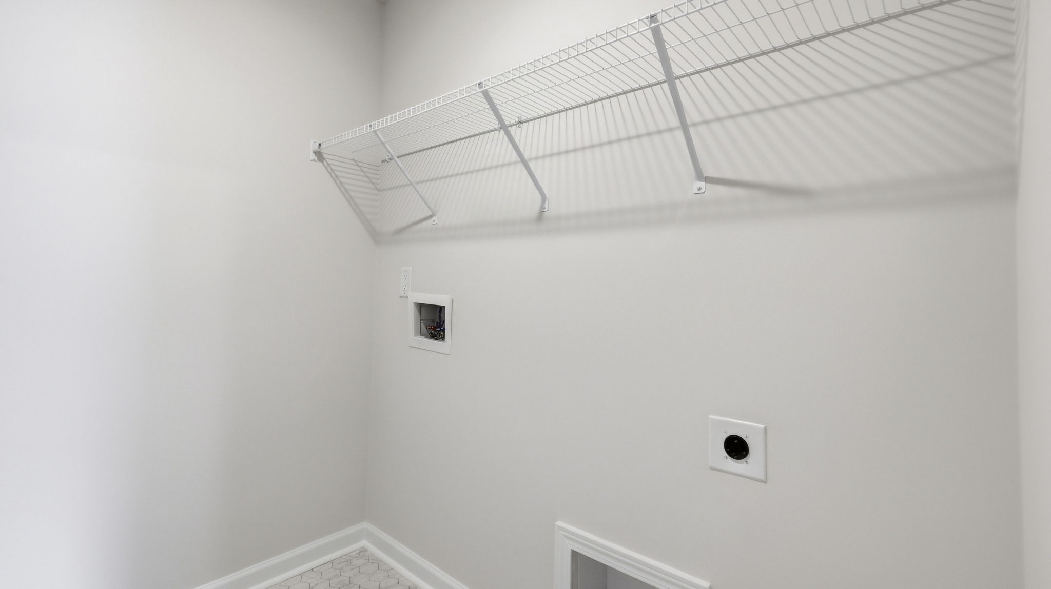 Laundry room with shelving