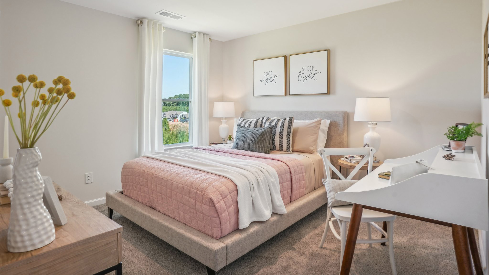 Model carpeted bedroom with small windowModel carpeted bedroom with small window