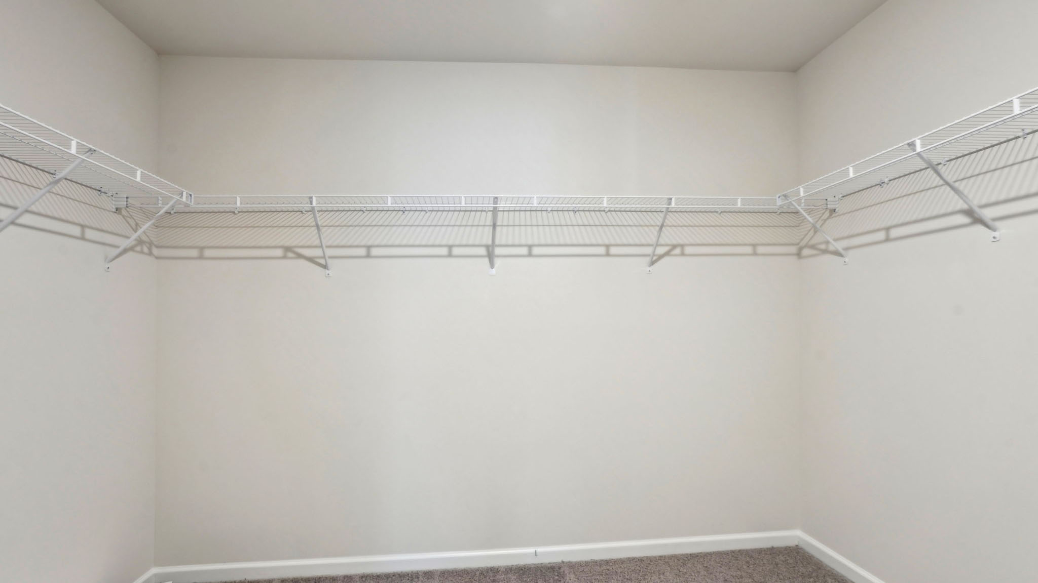 Walk in closet with shelving
