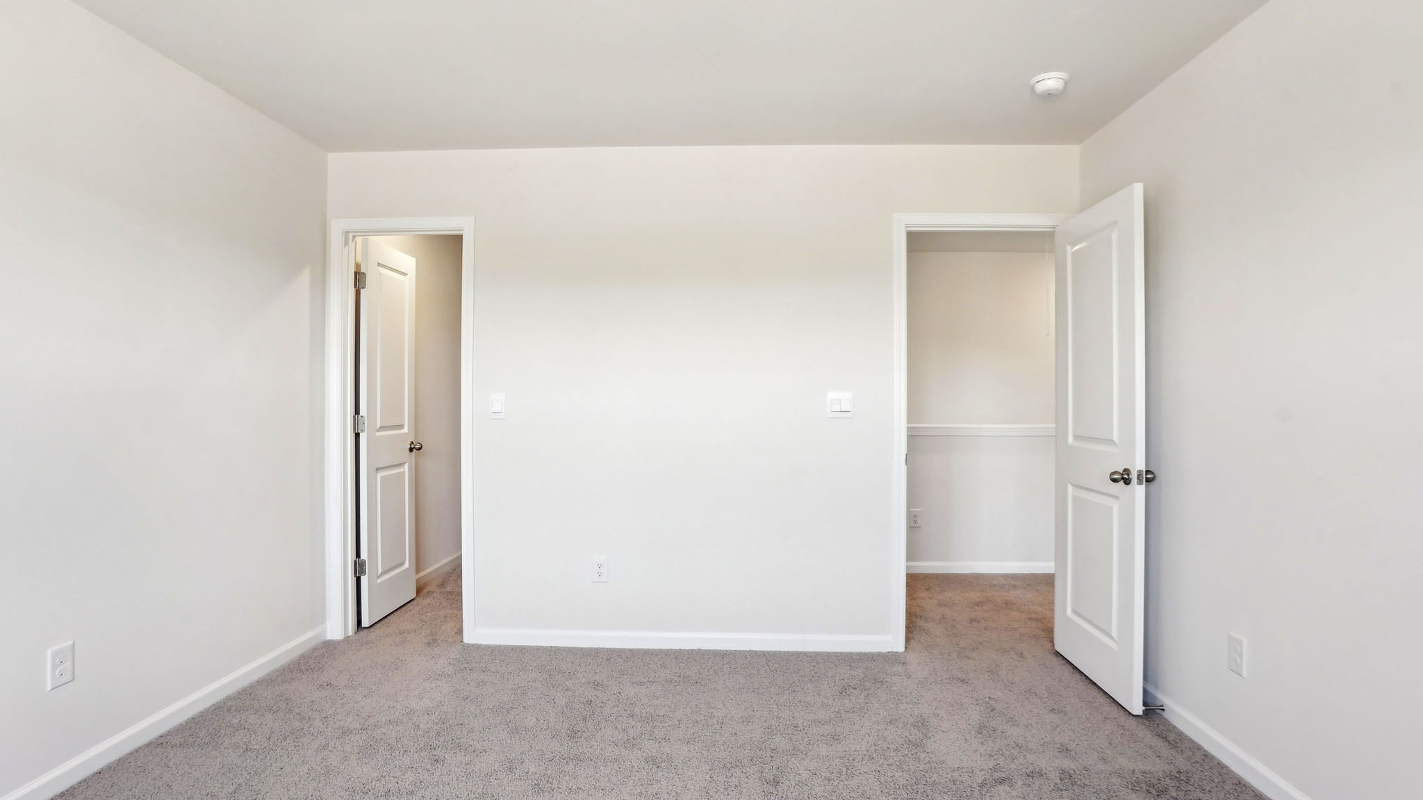 Carpeted bedroom with window