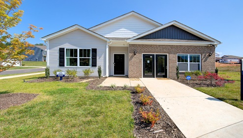 Valleywood Cali Model Front Exterior with brick, siding and store front sales center