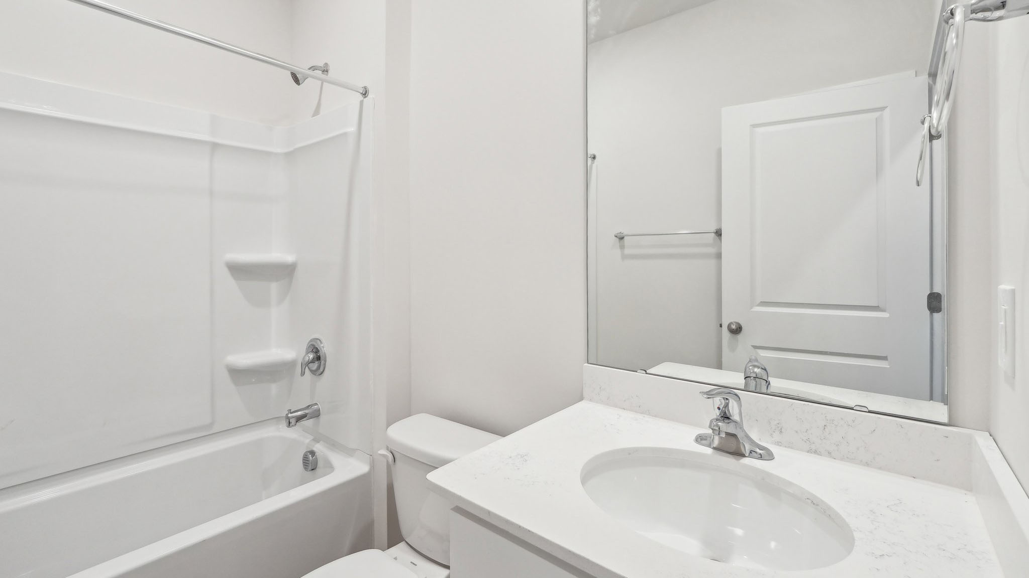 Carpeted bedroom with large window