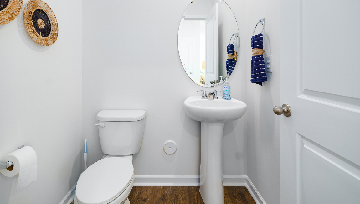 Powder bathroom with toilet and sink