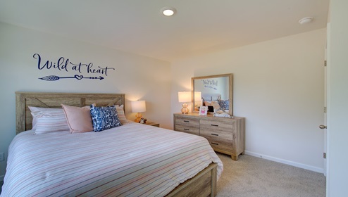carpeted bedroom with large window
