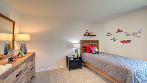 carpeted bedroom with large window