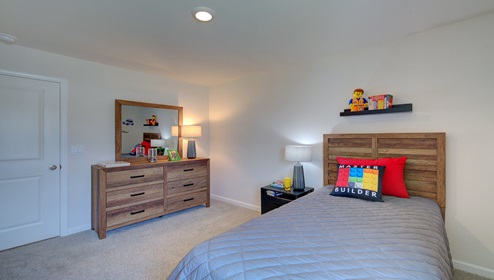 carpeted bedroom with large window