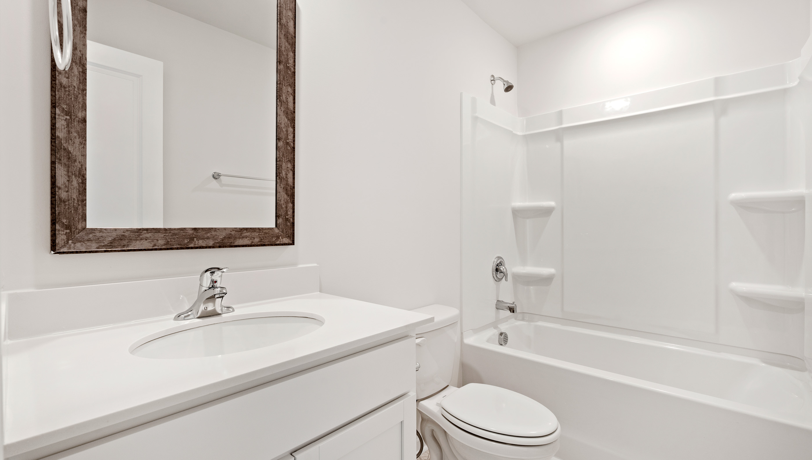 Bathroom with single vanity and bathtub