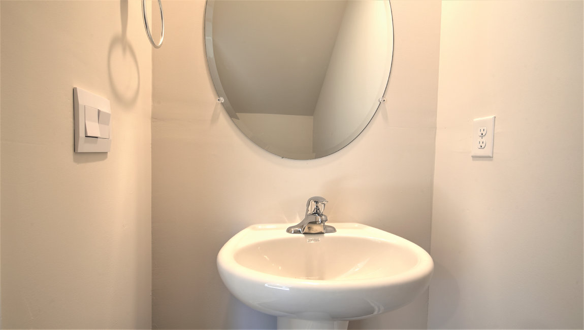 powder bathroom with sink and toilet