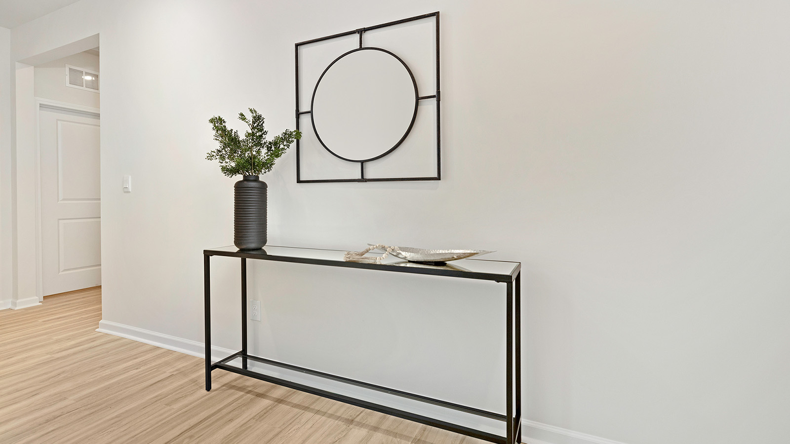 Welcoming foyer with wood floors
